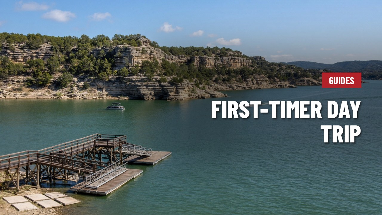 Lake Travis shoreline with limestone cliffs, a boat dock and boats on the water