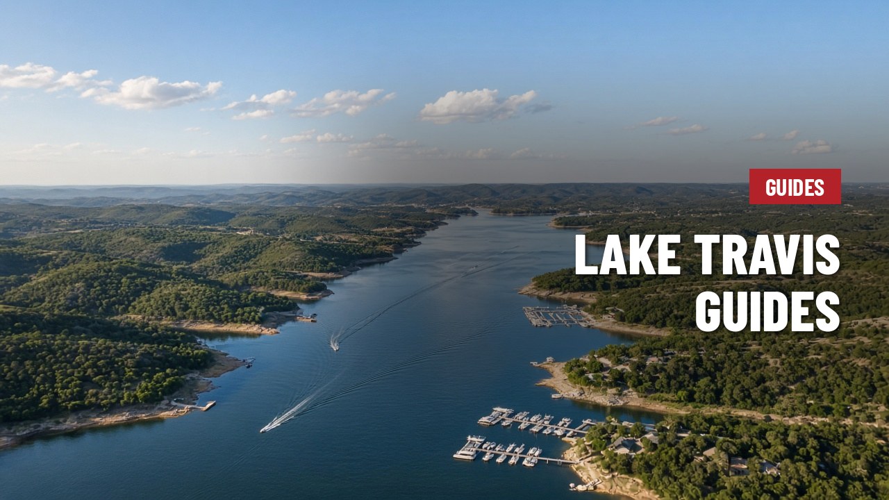Aerial view of Lake Travis winding through the Hill Country, with marinas and boats