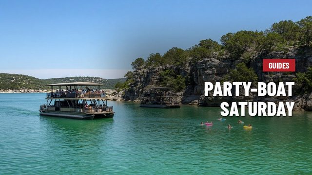 Double-decker party boat on Lake Travis near limestone cliffs, with people on floats