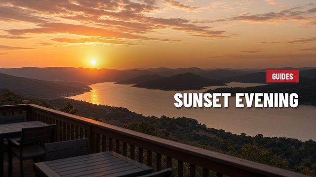 Orange sunset over Lake Travis and Hill Country ridges seen from a hillside deck