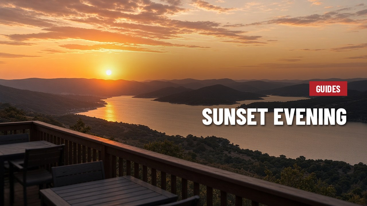Orange sunset over Lake Travis and Hill Country ridges seen from a hillside deck